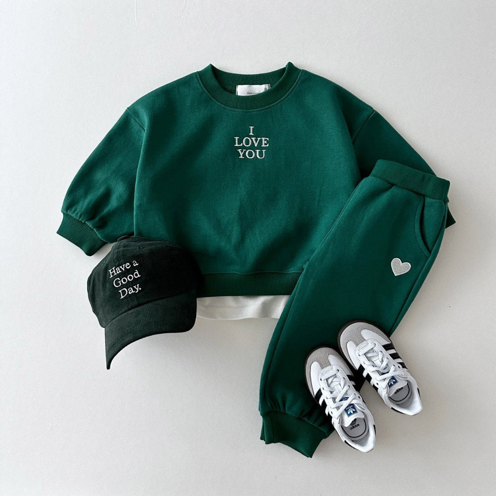 Kids' embroidered letter love comfortable sweater and matching two-piece suit from R&G Boutique, featuring colorful lettering and cozy fabric.