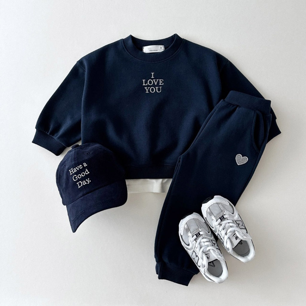 Kids' embroidered letter love sweater and matching pants set by R&G Boutique, featuring colorful embroidery and cozy fabric.