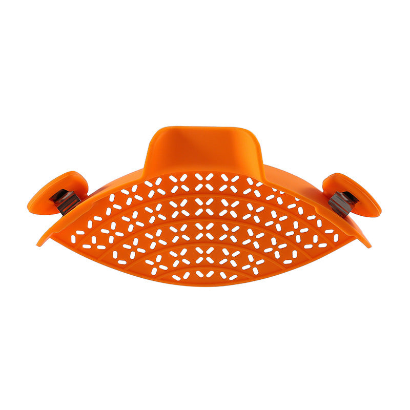 R&G Boutique silicone pot side drain stopper for kitchen gadgets, showing a flexible, bright silicone device with drain holes.