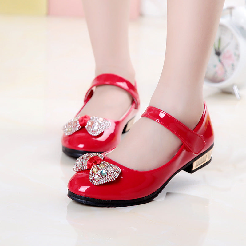 Creative Bowknot Cute Girls' Leather Shoes by R&G Boutique with a bow detail, soft leather upper, and comfortable design for children.